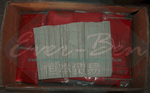 Bulk red rain ponchos in carton